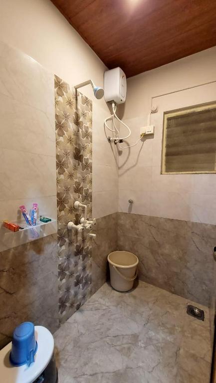 Koupelna v ubytování Vighnaharta Homestay