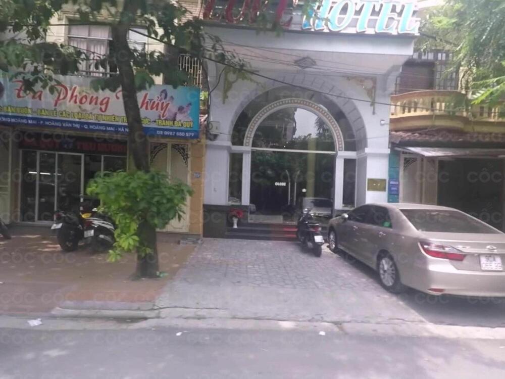 a car parked in front of a building at Hotel Love - 315 Đ. Hoàng Mai - by Bay Luxury in Hanoi