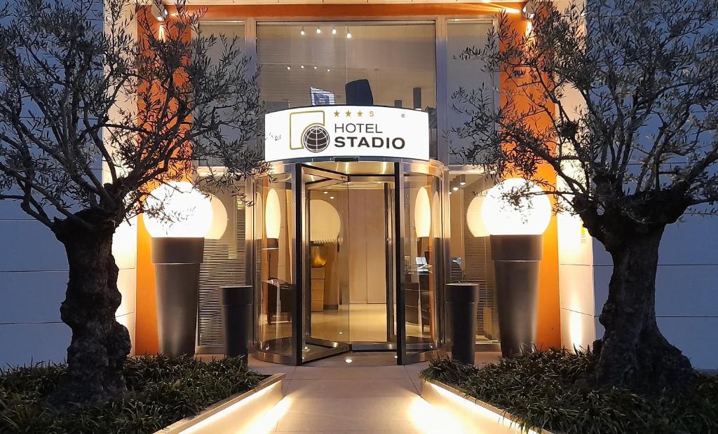 a hotel shado sign in front of a building at Stadio Hotel in Piacenza