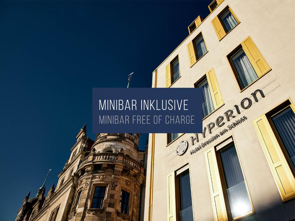 a building with a sign on the side of it at HYPERION Hotel Dresden Am Schloss in Dresden