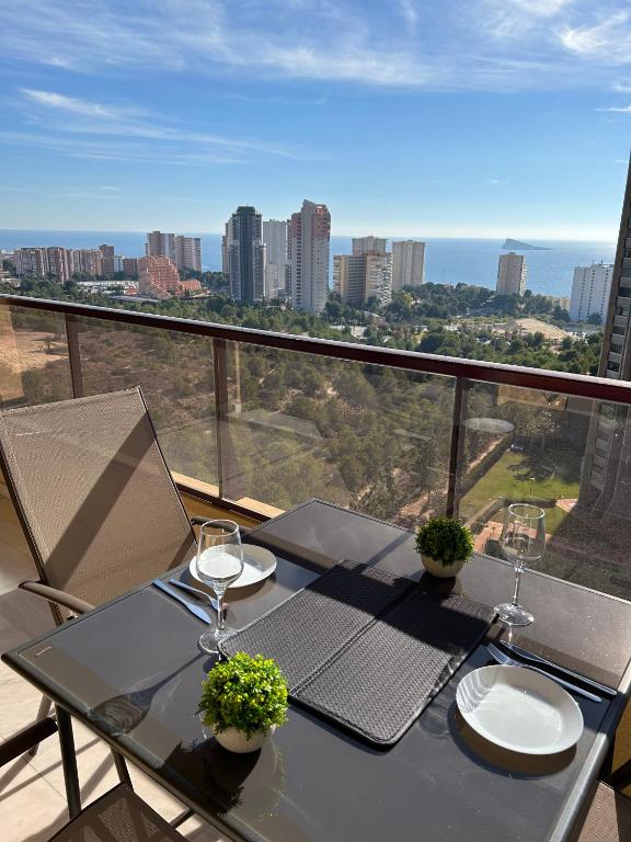 Hotel Terrazas Benidorm, a table with two wine glasses on a balcony at Terrazas Benidorm in Benidorm