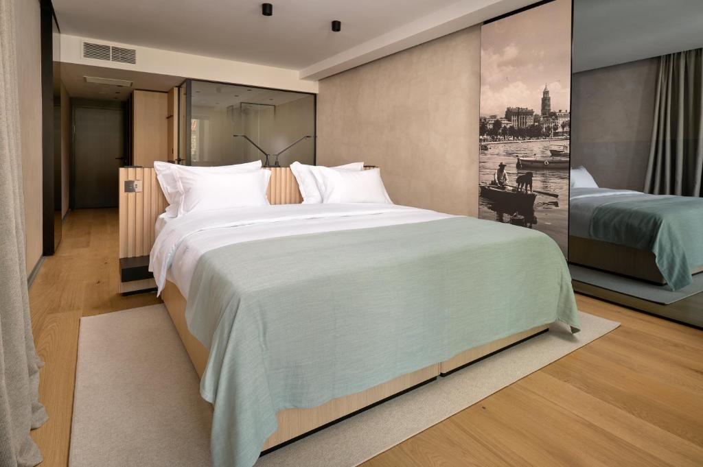Postel nebo postele na pokoji v ubytování Hotel Ambasador