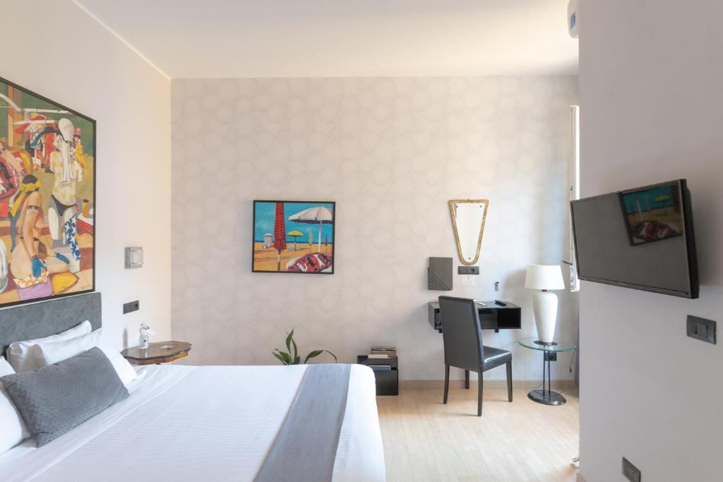 Postel nebo postele na pokoji v ubytování Aiello Rooms
