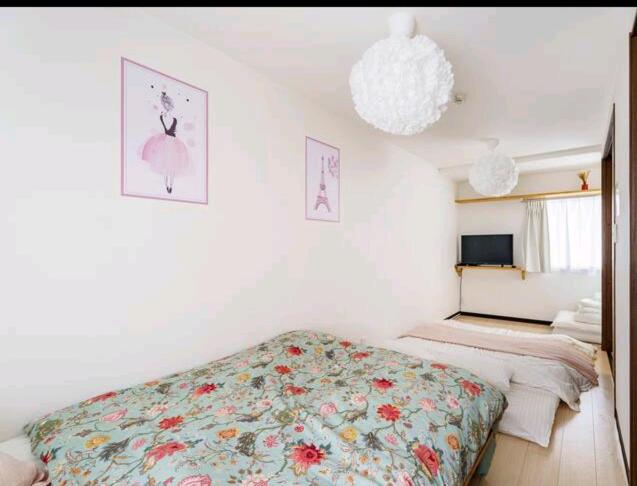 Ein Bett oder Betten in einem Zimmer der Unterkunft Healing Inn Osaka Fukushima