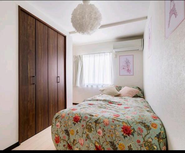 Ein Bett oder Betten in einem Zimmer der Unterkunft Healing Inn Osaka Fukushima