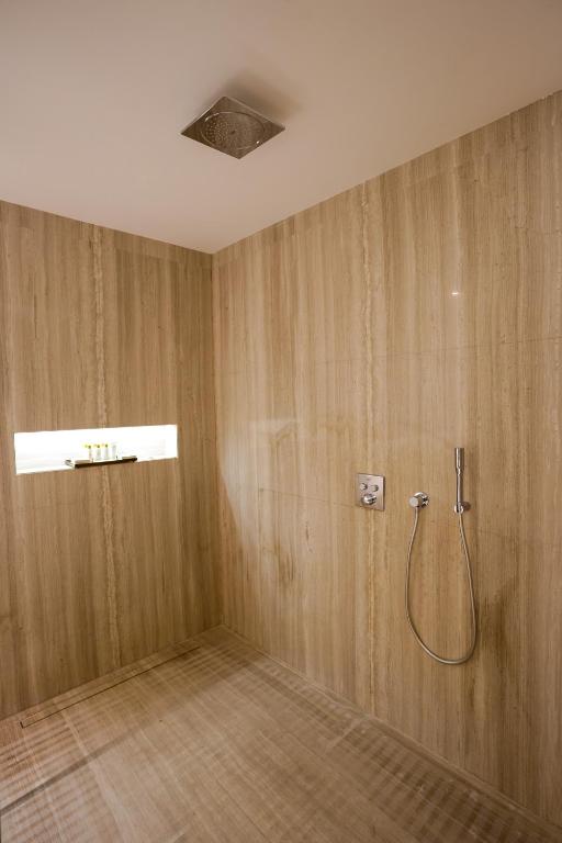 a bathroom with a shower in a room at Mirfa Hotel in Al Mirfa