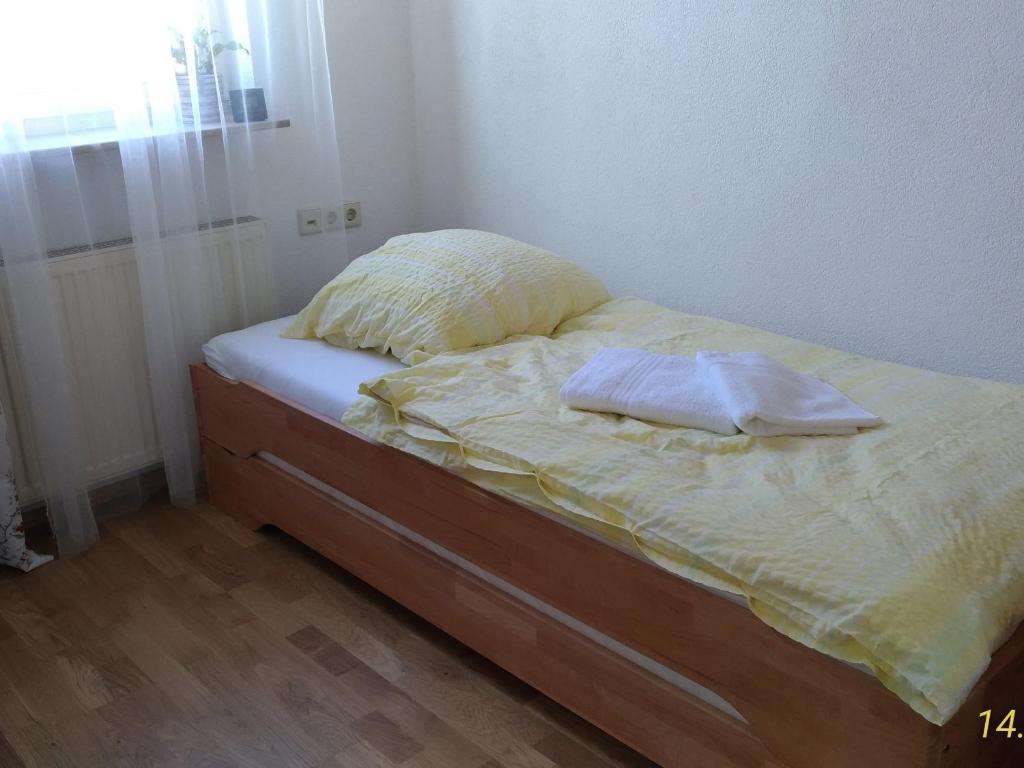 a bed with two pillows on it in a bedroom at Fewo Reutlingen Metzstraße in Reutlingen