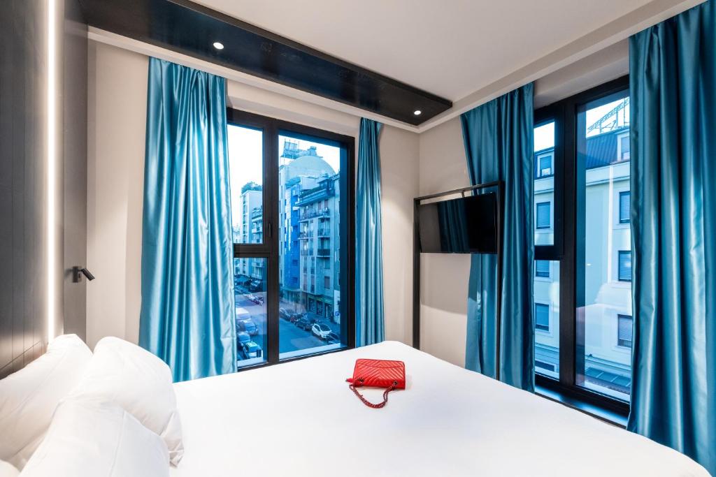 Postel nebo postele na pokoji v ubytování Smart Hotel Central