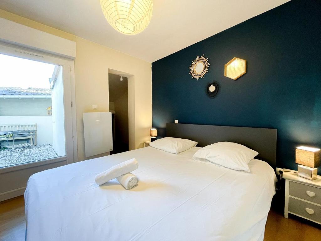 Katil atau katil-katil dalam bilik di L'olivier - Appartement avec terrasse