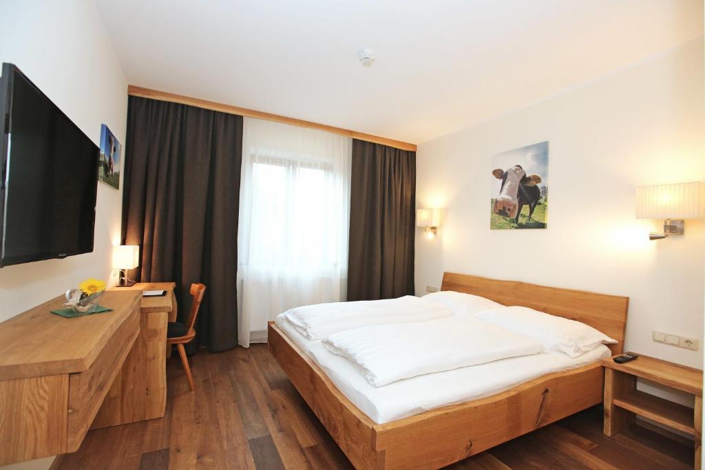 Postel nebo postele na pokoji v ubytování Aktivhotel Wildschütz