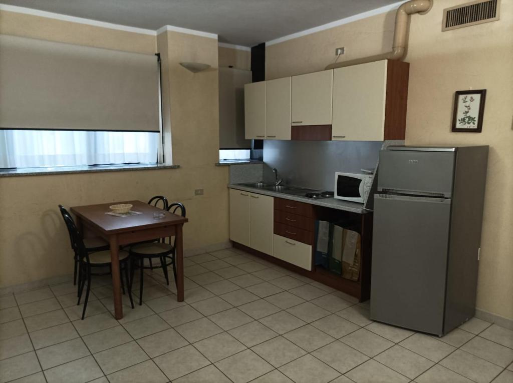 Kuchyň nebo kuchyňský kout v ubytování Residence Le Arcate