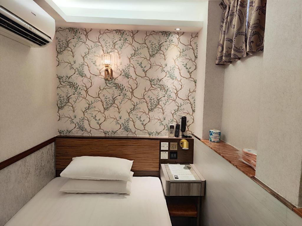 Postel nebo postele na pokoji v ubytování Celltronik Hostel 先創旅店
