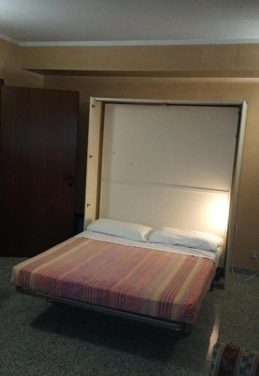 Postel nebo postele na pokoji v ubytování Residence Le Arcate