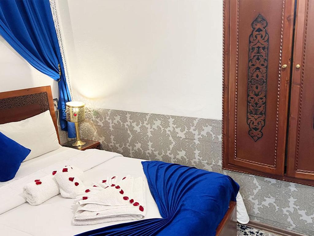 Postel nebo postele na pokoji v ubytování Riad Lazord