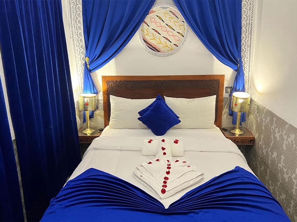 Postel nebo postele na pokoji v ubytování Riad Lazord