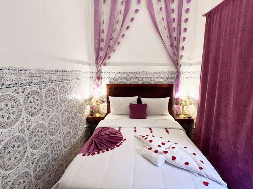 Postel nebo postele na pokoji v ubytování Riad Lazord