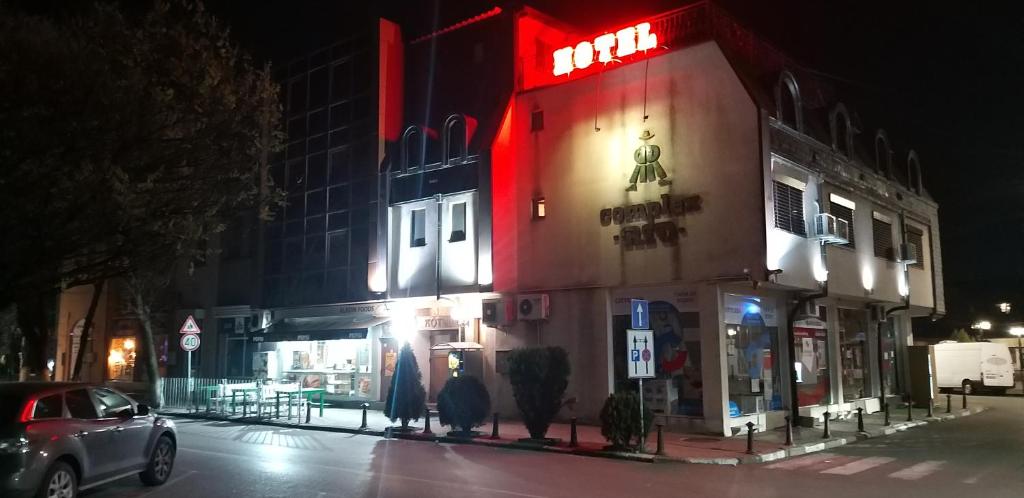 a building with a red light on the side of it at Hotel Rio in Nova Zagora