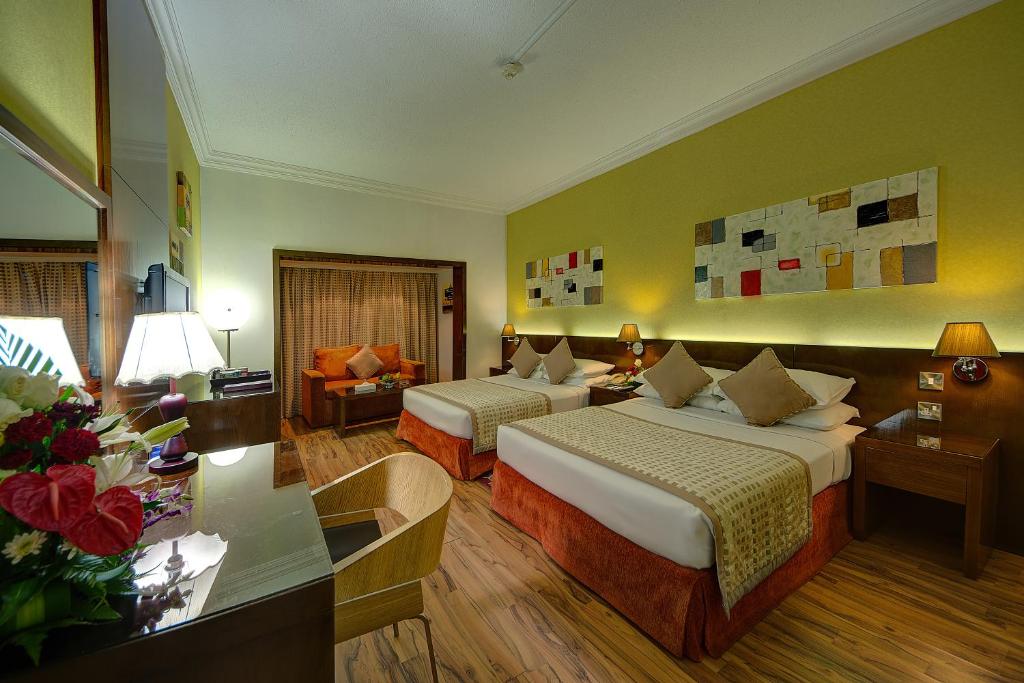 Postel nebo postele na pokoji v ubytování Ascot Hotel