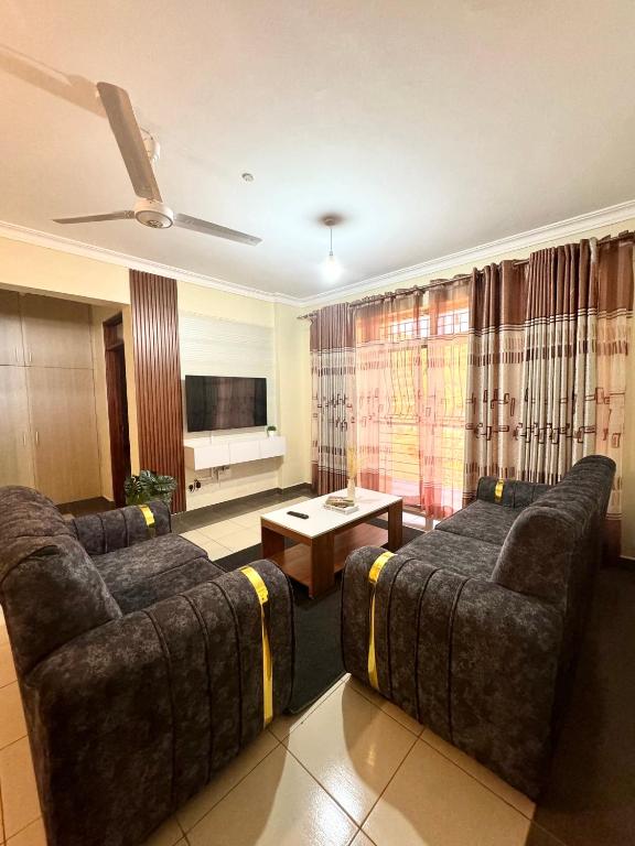 TV a/nebo společenská místnost v ubytování Hillsview Apartment