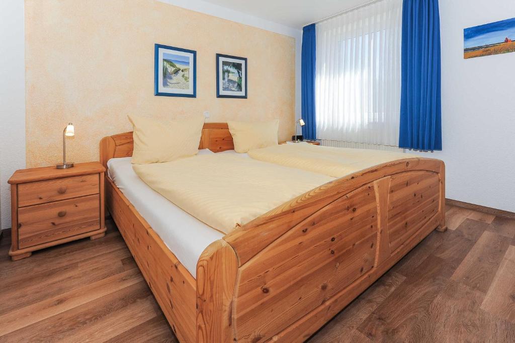 Postel nebo postele na pokoji v ubytování Ferienhaeuser Deichkrone