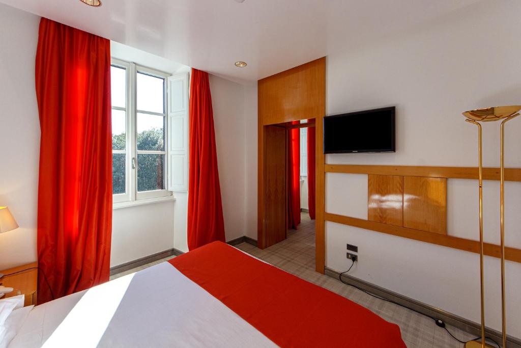 Postel nebo postele na pokoji v ubytování Albani Hotel Roma