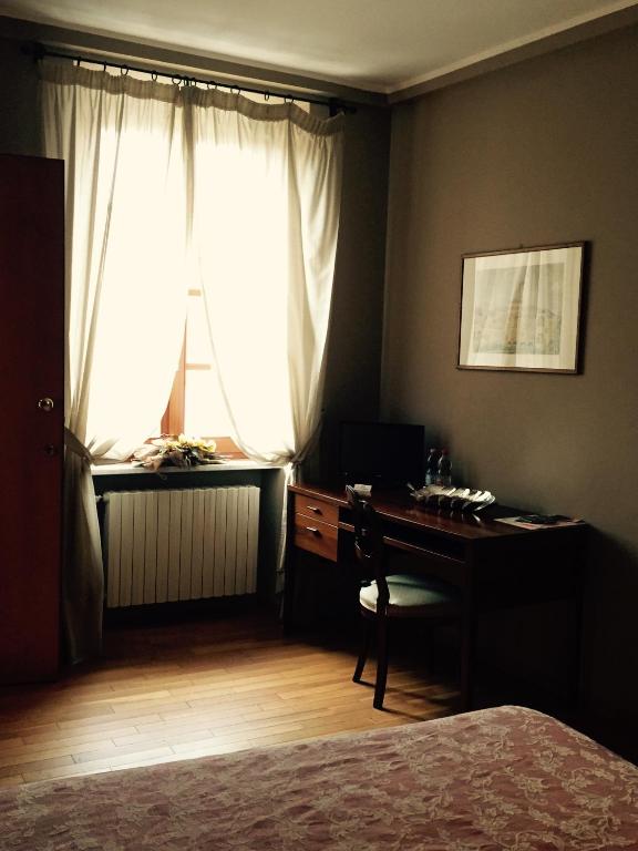 Postel nebo postele na pokoji v ubytování Albergo San Lorenzo