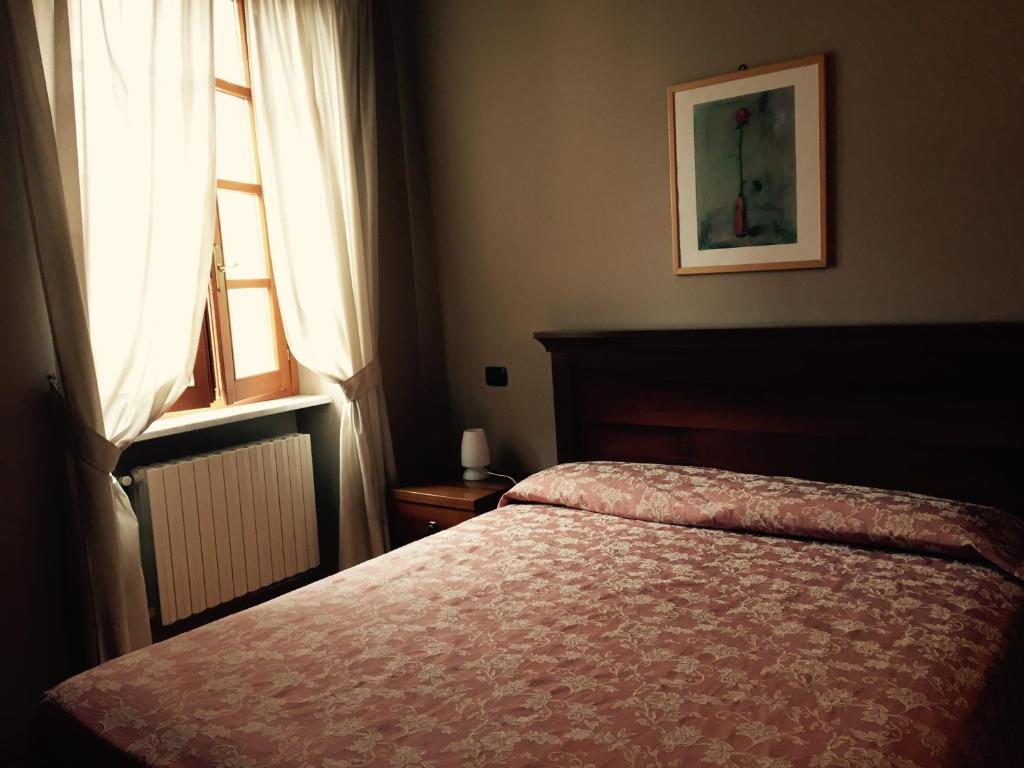 Postel nebo postele na pokoji v ubytování Albergo San Lorenzo