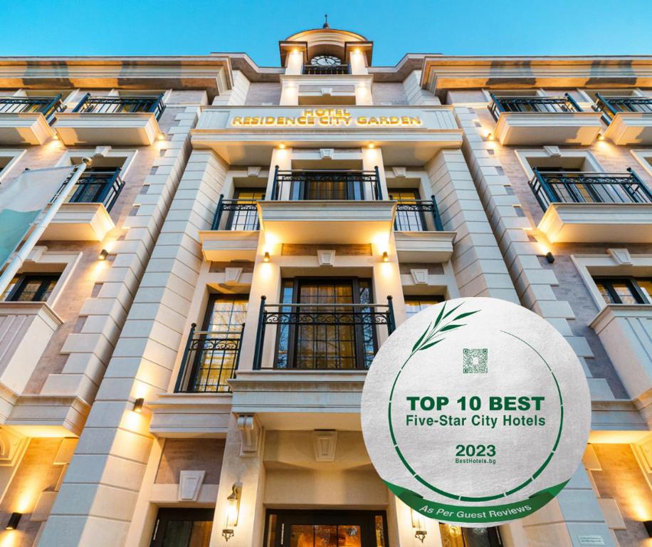 a tall building with a top best five star city hotels at Residence City Garden - Certificate of Excellence 3rd place in Top 10 BEST Five-Stars City Hotels for 2023 awarded by HTIF in Plovdiv