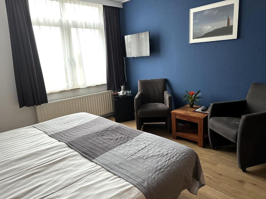 Postel nebo postele na pokoji v ubytování DuinHotel Texel