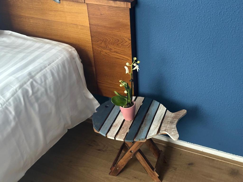 Postel nebo postele na pokoji v ubytování DuinHotel Texel