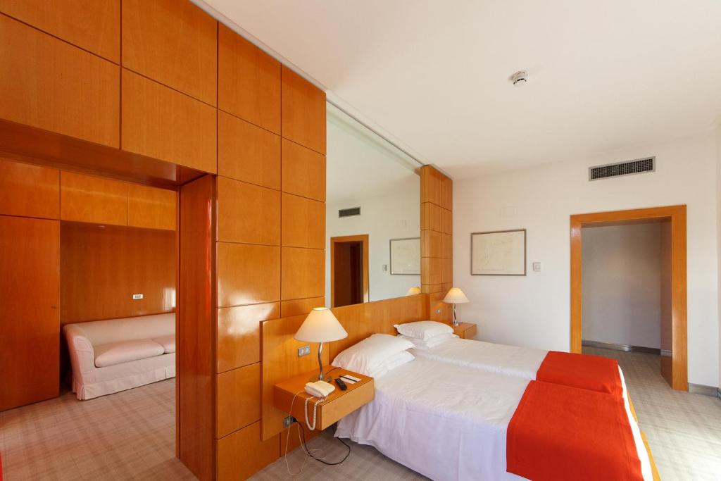 Postel nebo postele na pokoji v ubytování Albani Hotel Roma