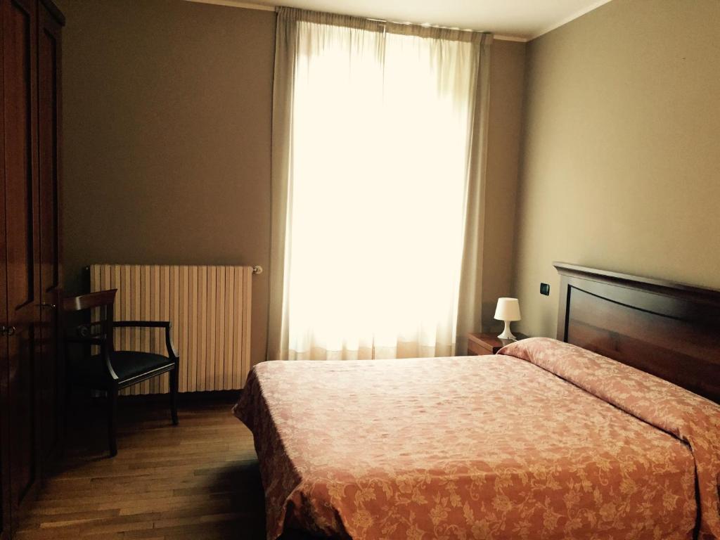 Postel nebo postele na pokoji v ubytování Albergo San Lorenzo