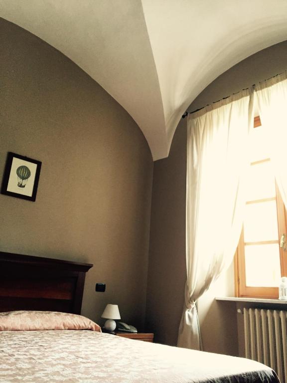 Postel nebo postele na pokoji v ubytování Albergo San Lorenzo