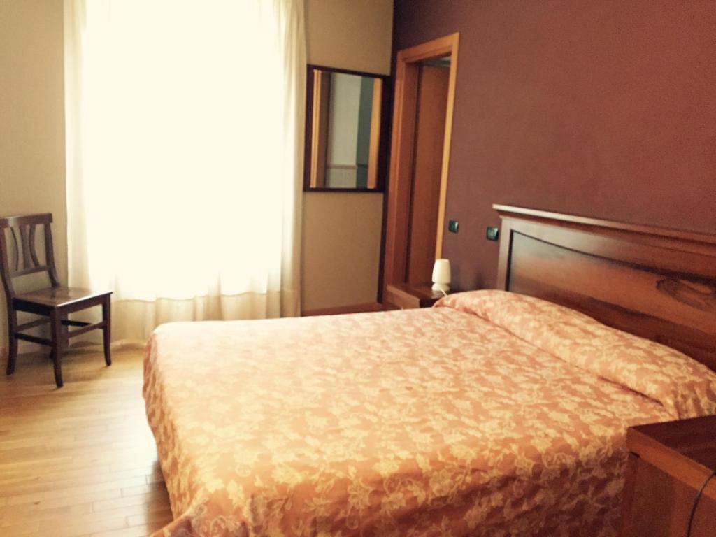 Postel nebo postele na pokoji v ubytování Albergo San Lorenzo