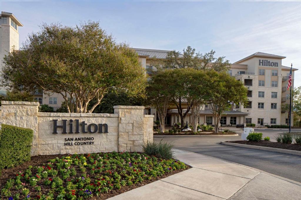 a sign for the hilton san francisco in front of a building at Hilton San Antonio Hill Country in San Antonio