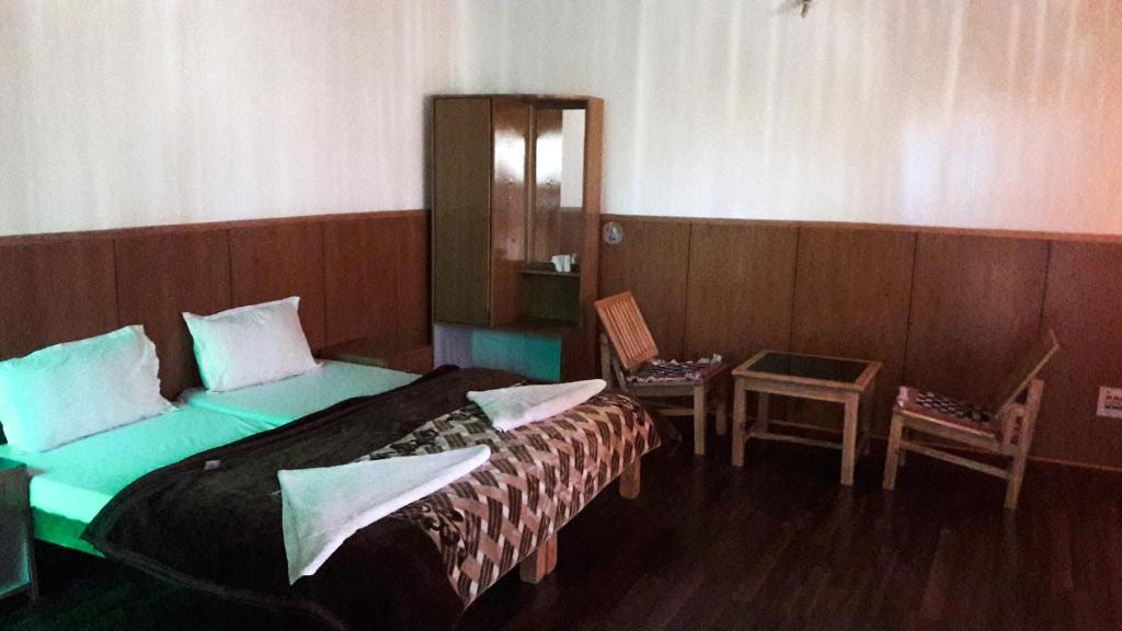 Letto o letti in una camera di Chubi Sponbo