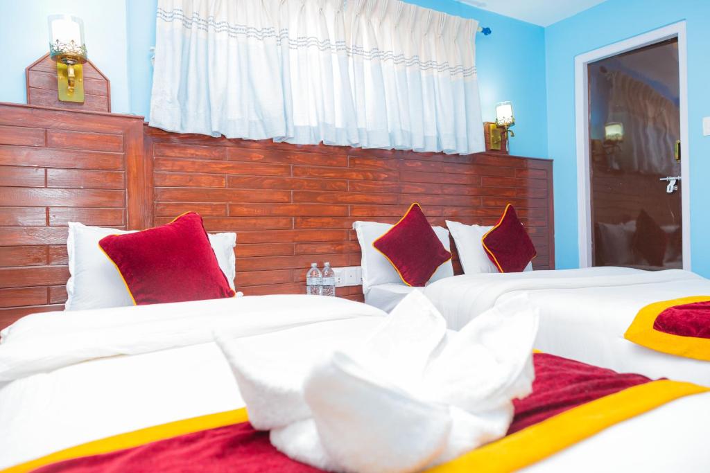 Voodi või voodid majutusasutuse Hotel The Billabong Garden Pokhara toas