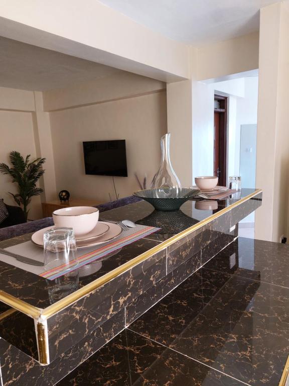 TV a/nebo společenská místnost v ubytování Rawin Homes