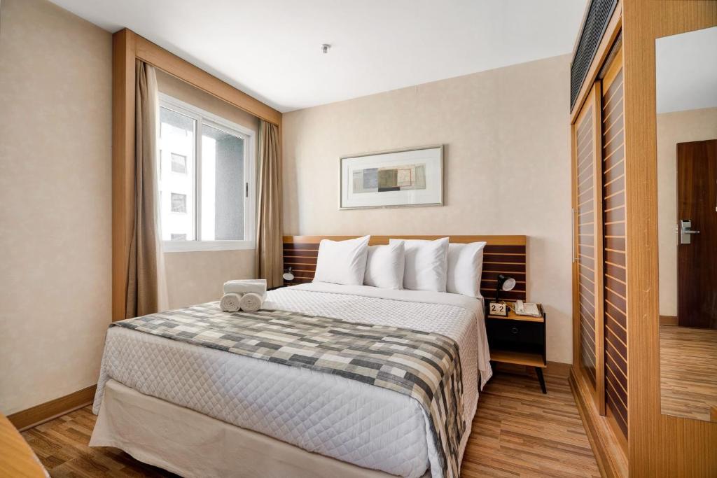 Posteľ alebo postele v izbe v ubytovaní Suítes Inside Hotel Windham Paulista