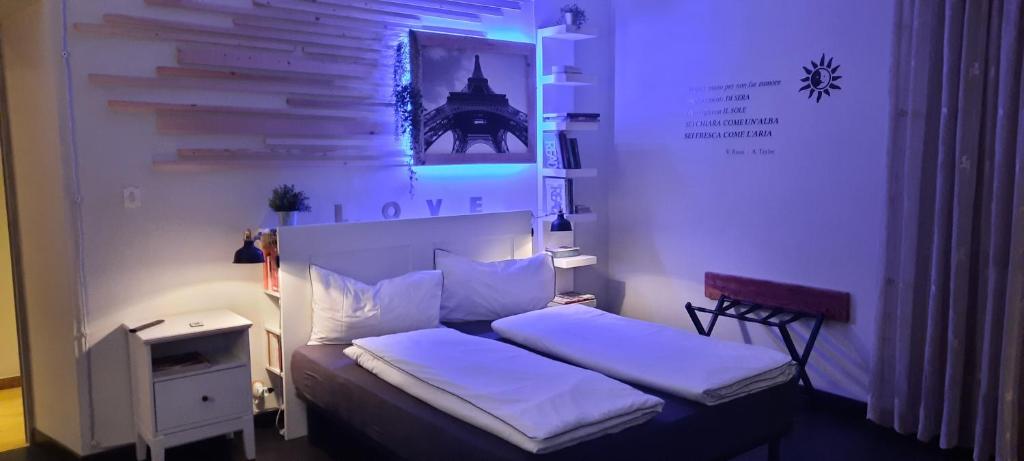 a small bedroom with a bed with a light on it at Civico 4 in Castrovillari