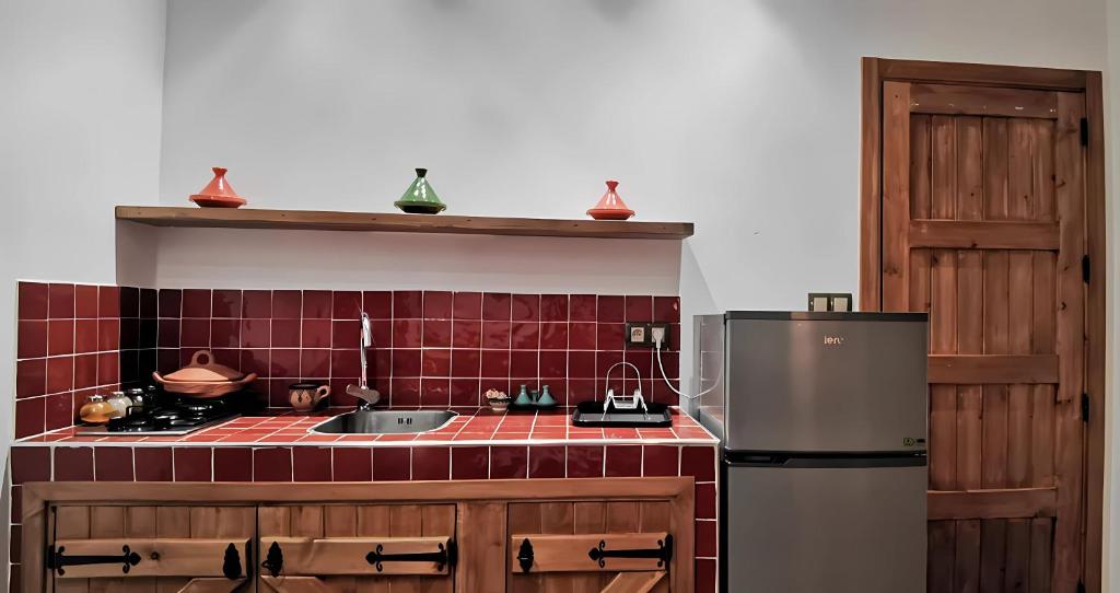 Kuchyň nebo kuchyňský kout v ubytování Aparthotel Dar Nowara Chaouen