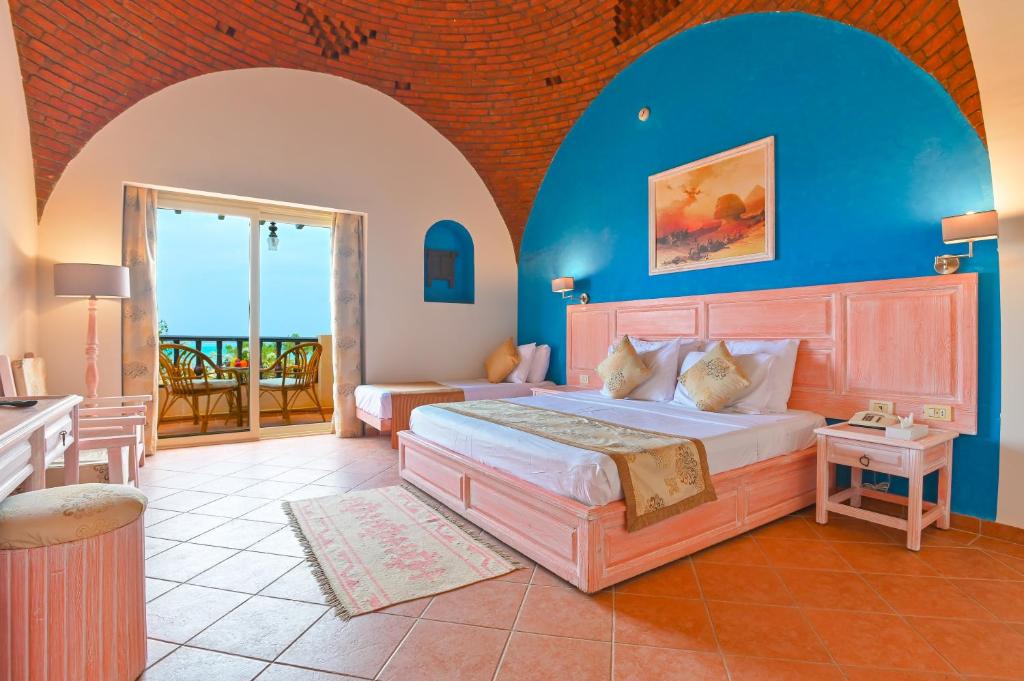 Кровать или кровати в номере Dream Lagoon Resort & Aqua Park