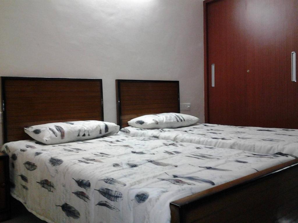 Lova arba lovos apgyvendinimo įstaigoje Vrindavan Guest House