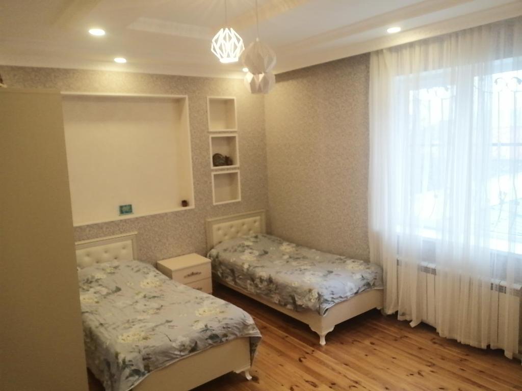 Giường trong phòng chung tại Cehrayı Villa