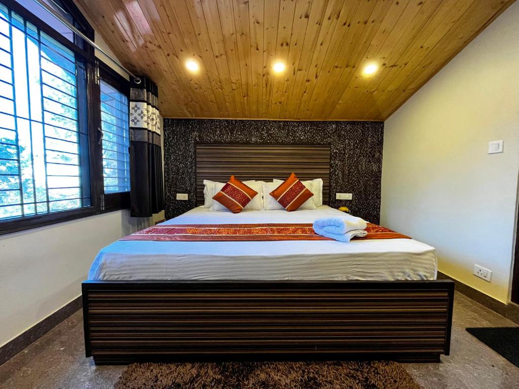 Postel nebo postele na pokoji v ubytování Puri's BnB