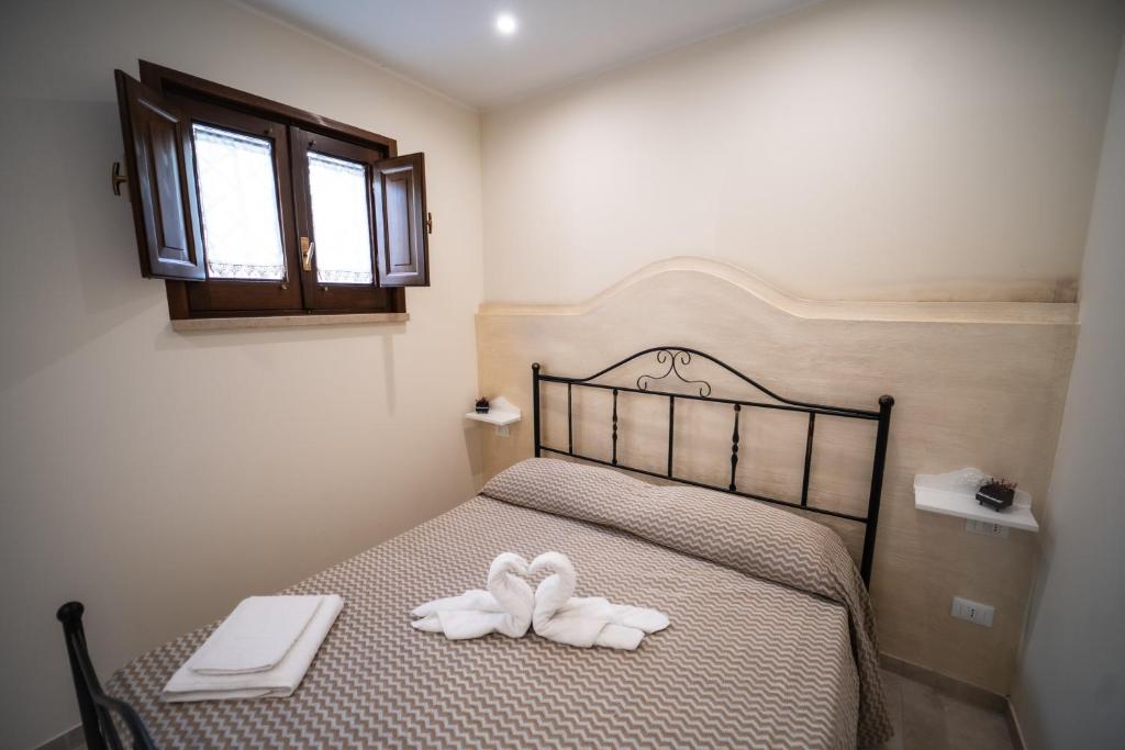 Postel nebo postele na pokoji v ubytování B&B La Dimora di Pepè