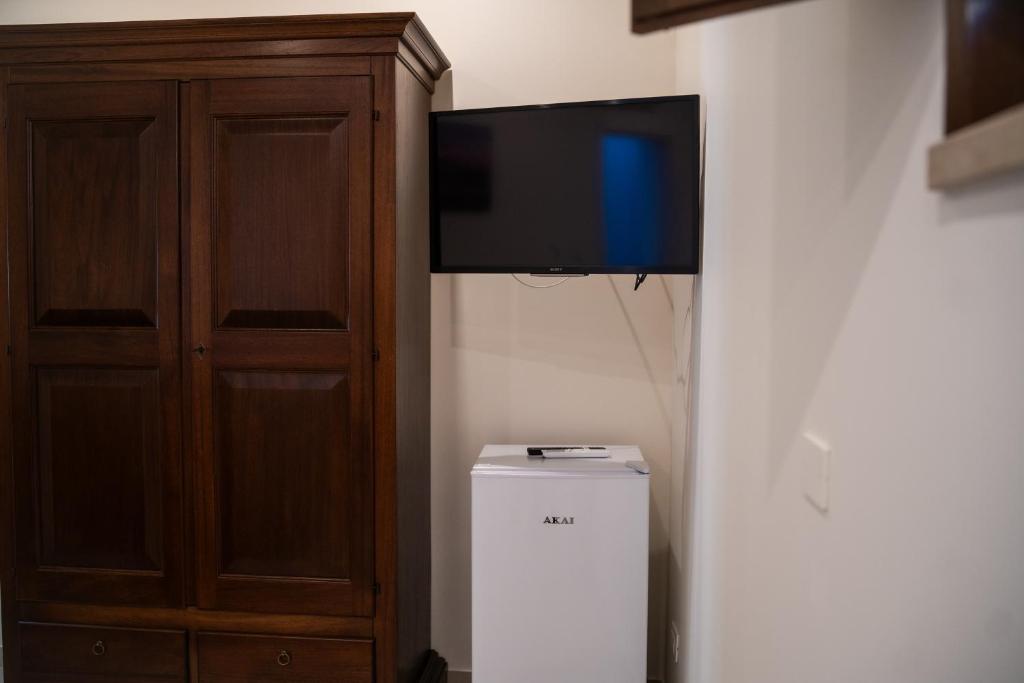 TV a/nebo společenská místnost v ubytování B&B La Dimora di Pepè