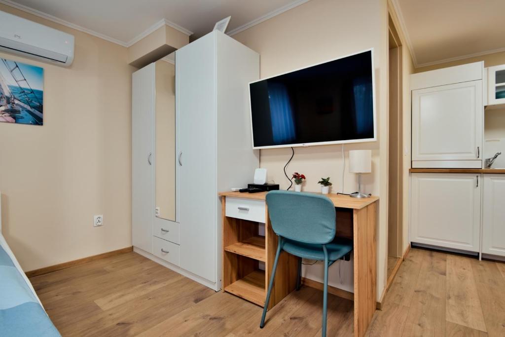 Kuchyň nebo kuchyňský kout v ubytování Palmy Apartmanhouse Maglód