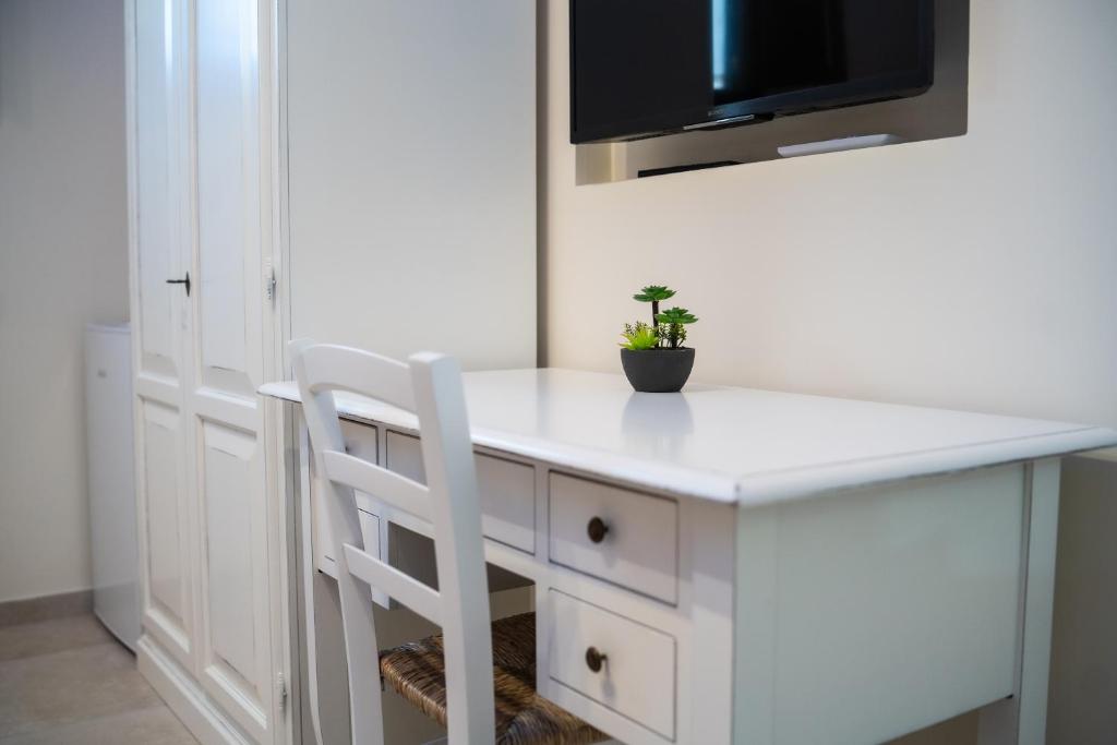 TV a/nebo společenská místnost v ubytování B&B La Dimora di Pepè