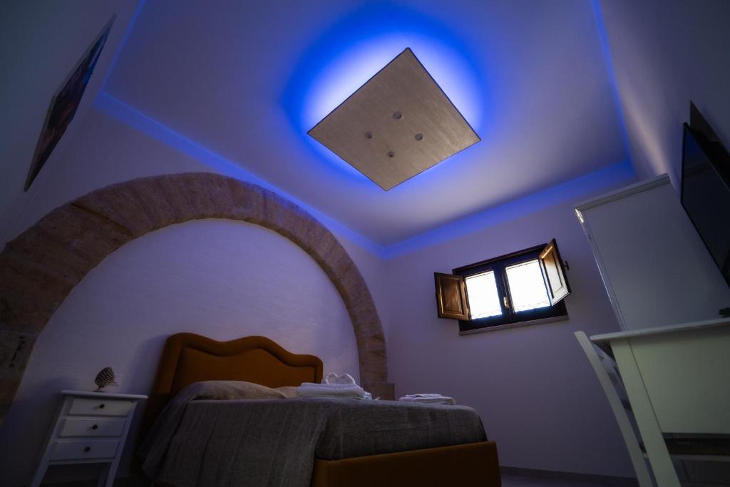 Postel nebo postele na pokoji v ubytování B&B La Dimora di Pepè